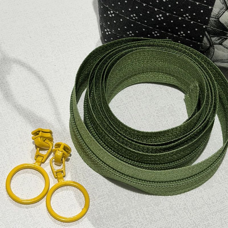 Glidelås-pakke. 1m glidelås og 2 glidere med ring